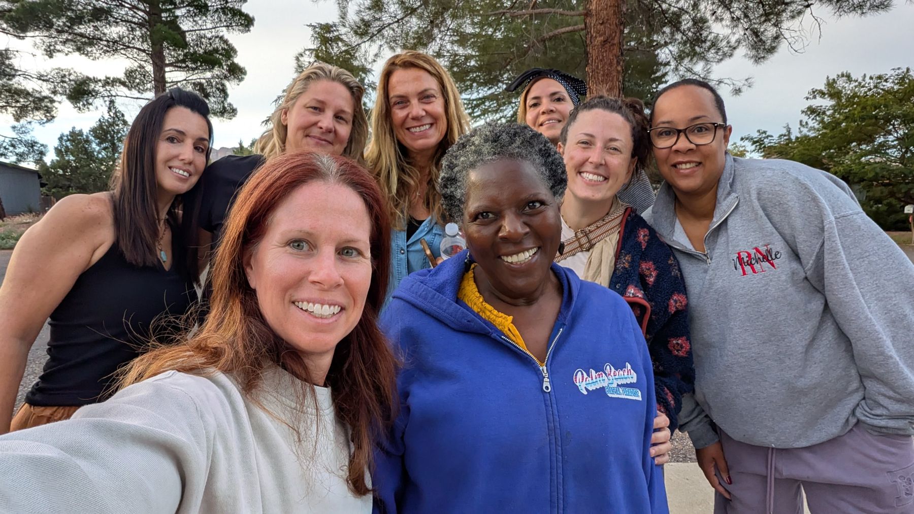 A group of smiling retreat guests together in Sedona
